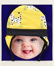 Load image into Gallery viewer, Tie Knot Cap with Ear Flaps Animal Print Yellow
